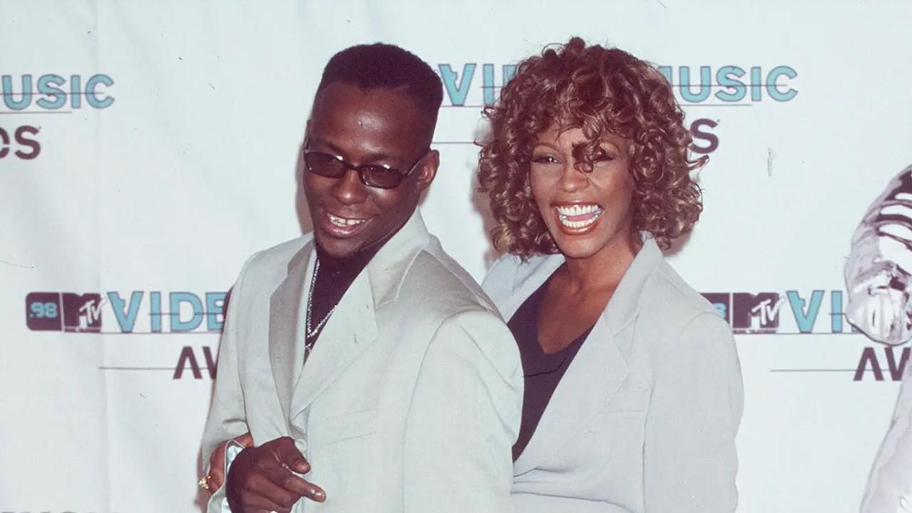 Bobby Brown and Whitney Houston wearing gray suits at the 1998 MTV Video Music Awards on Sept. 9, 1998.