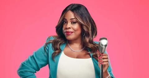 Niecy Nash posing with a microphone for 'Don't Forget the Lyrics!'