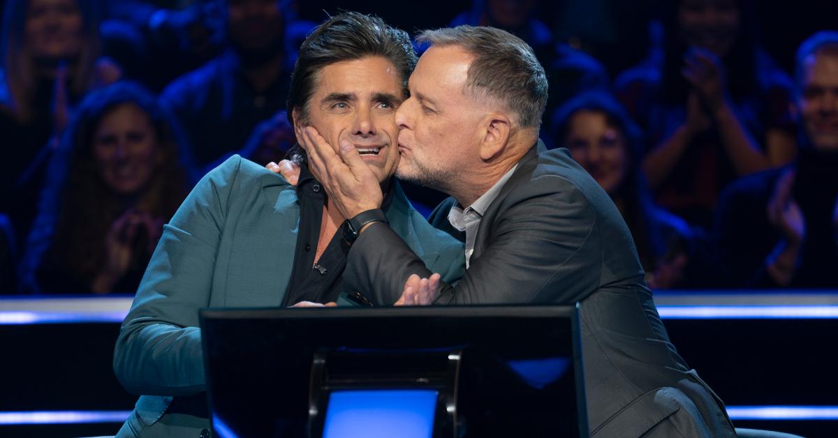 Dave Coulier kisses John Stamos on the cheek during 'Who Wants to Be a Millionaire.'