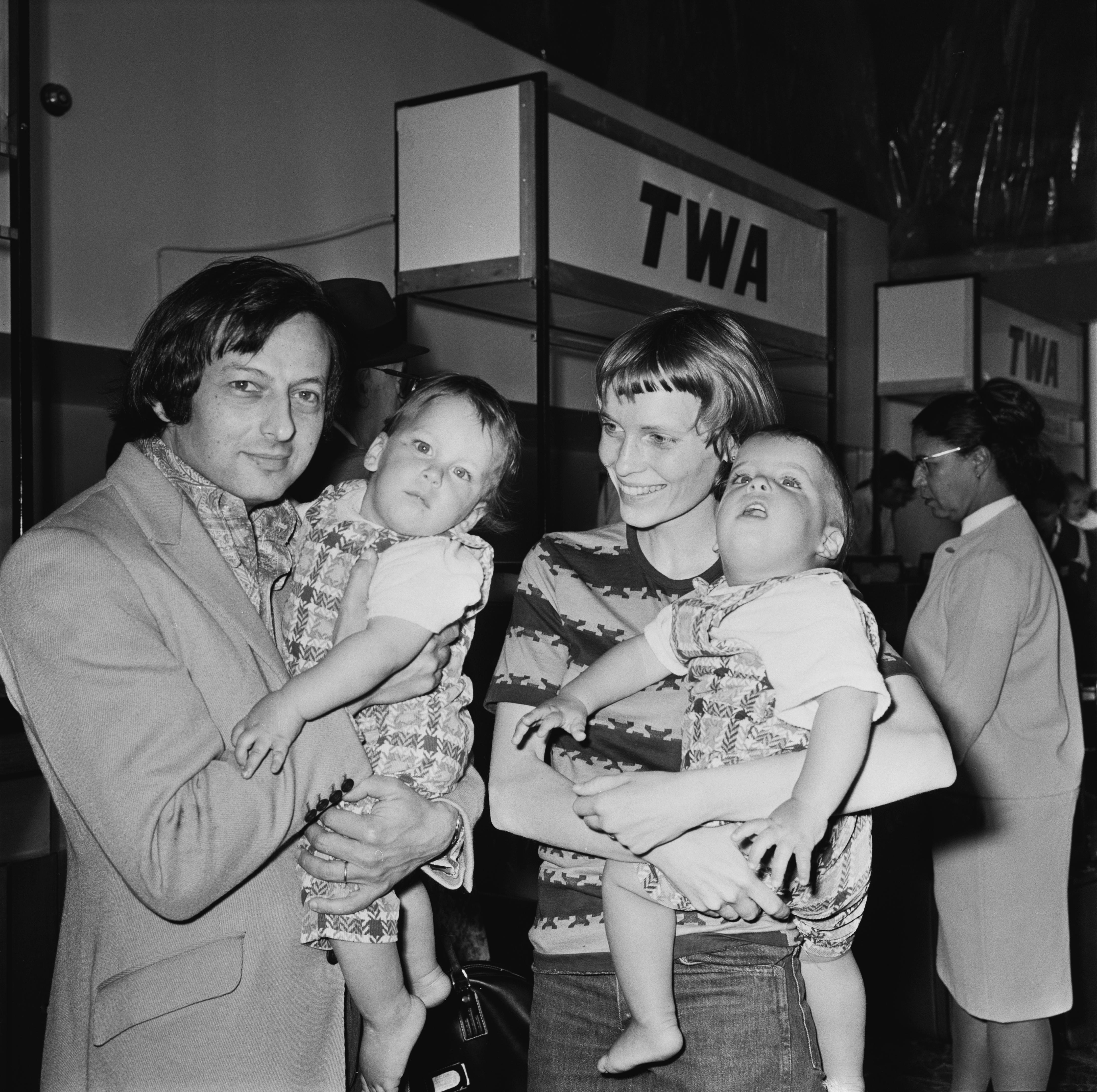 Mia Farrow and two of her children