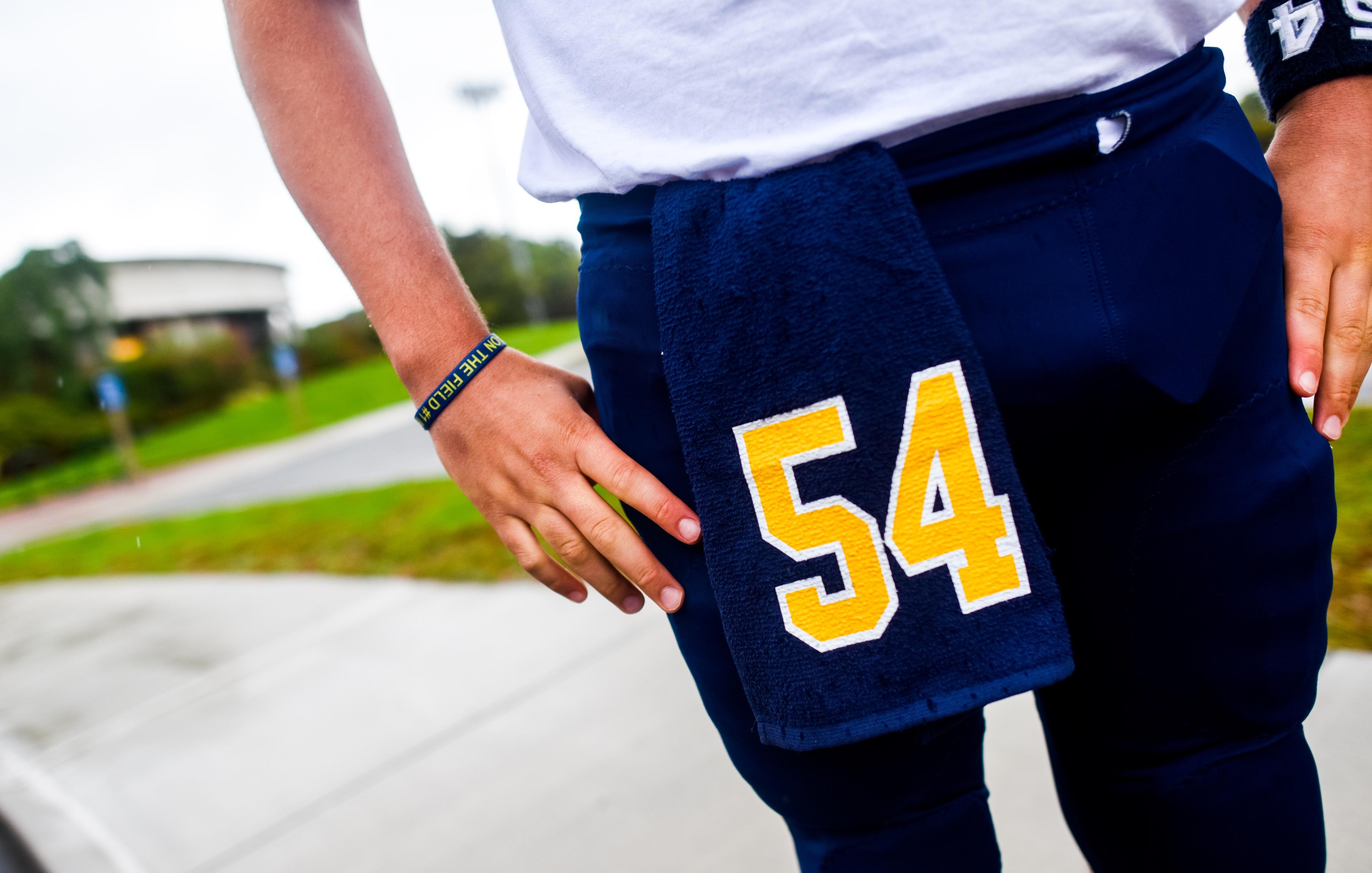 Football players frequently don towels during games