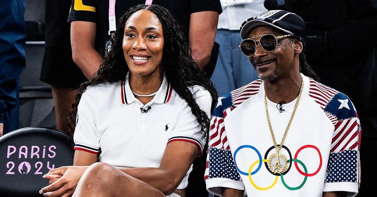 A’ja Wilson and Snoop Dogg at the 2024 Paris Olympics sitting in stands and smiling