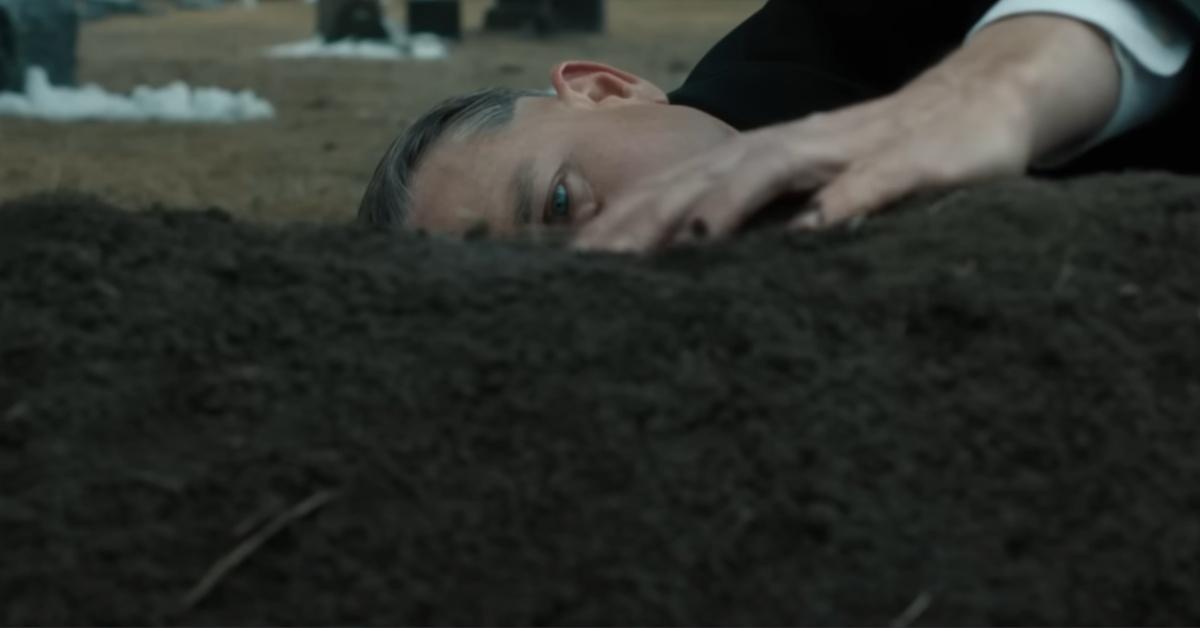 Charlie Hunnam stars as Ed Gein at his mother's grave in 'MONSTER: The Ed Gein Story'