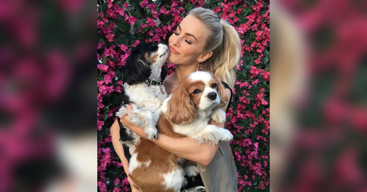 Julianne Hough posing with her late dogs, Lexi and Harley.