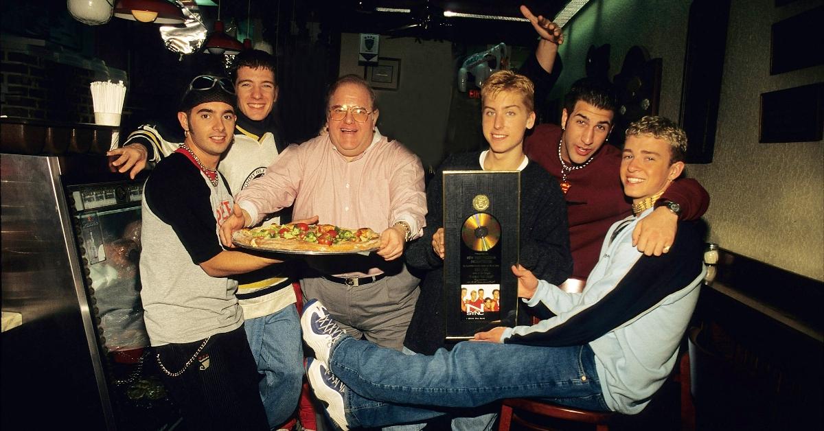 Lou Pearlman with NSYNC in a pizza shop