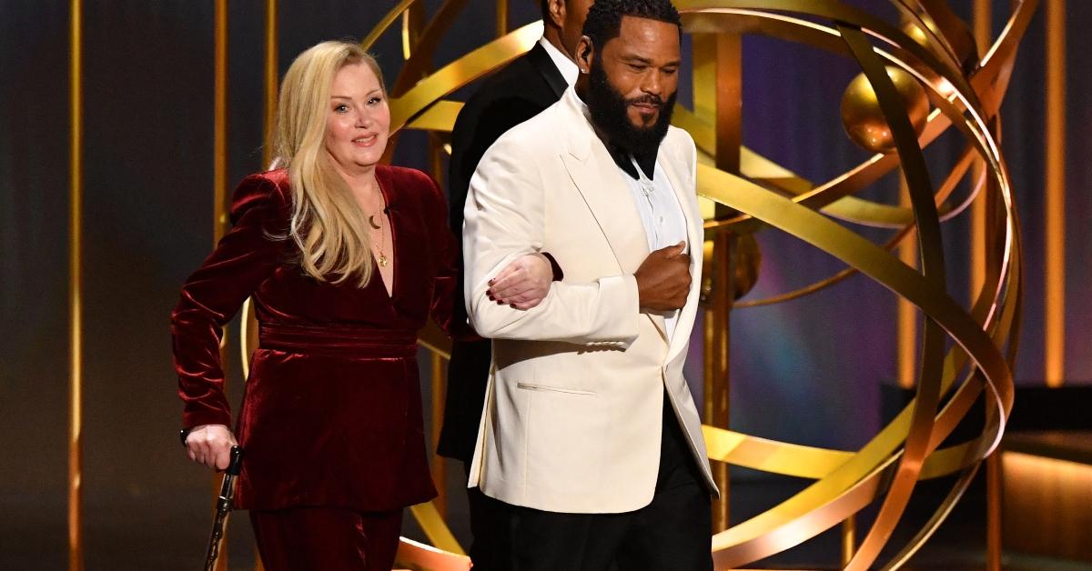 Actor Anthony Anderson and US actress Christina Applegate step onstage during the 75th Emmy Awards at the Peacock Theatre at L.A. Live in Los Angeles on January 15, 2024. (Photo by Valerie Macon / AFP) (Photo by VALERIE MACON/AFP via Getty Images)