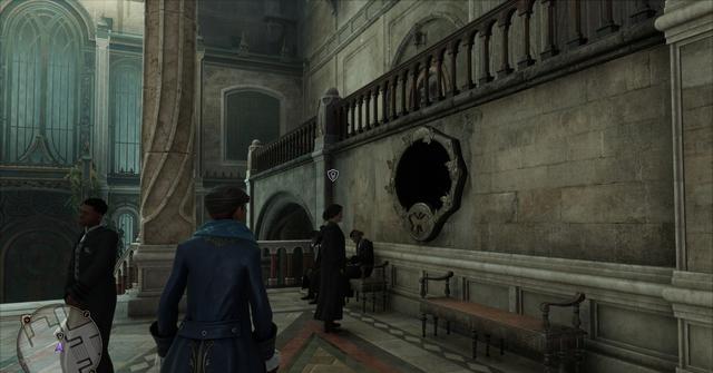 'Hogwarts Legacy' Player looking at a mirror with a moth-shaped symbol on it.