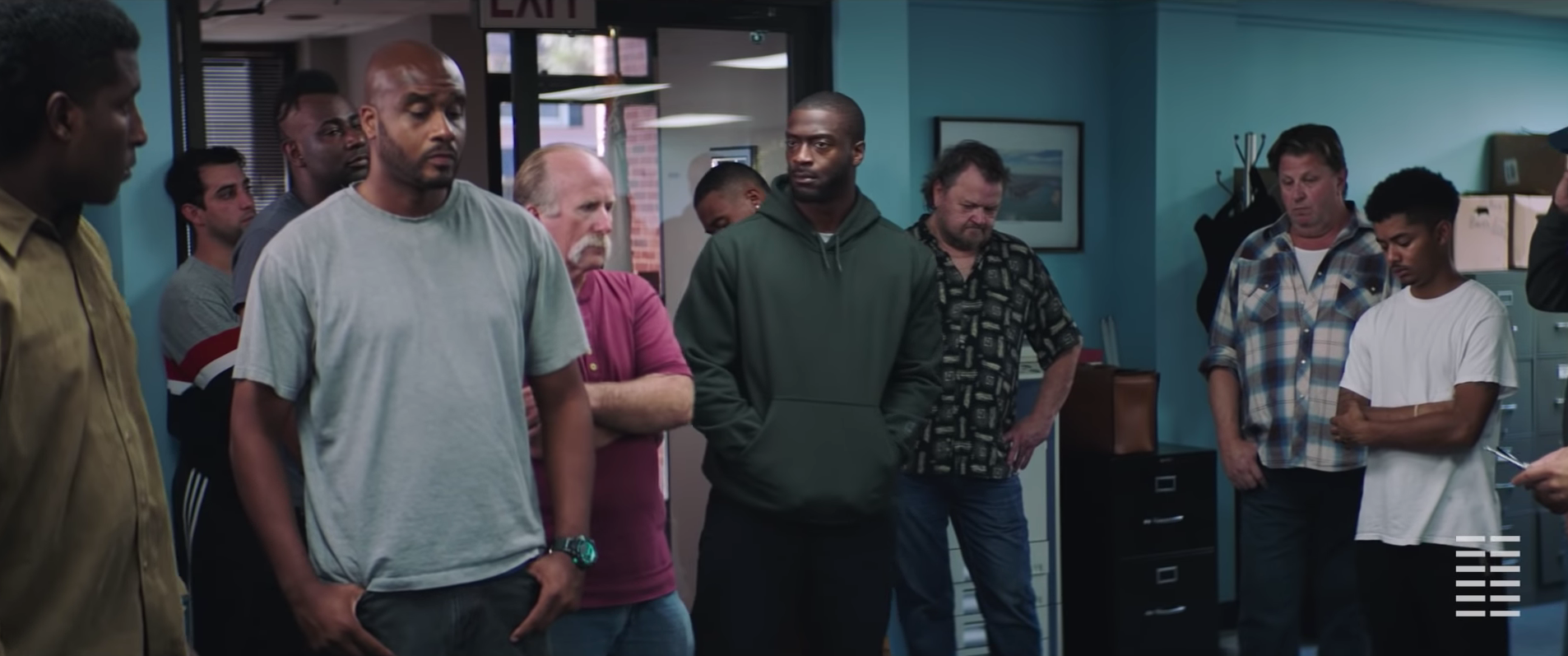 Brian Banks (Aldis Hodge) standing in a group of people