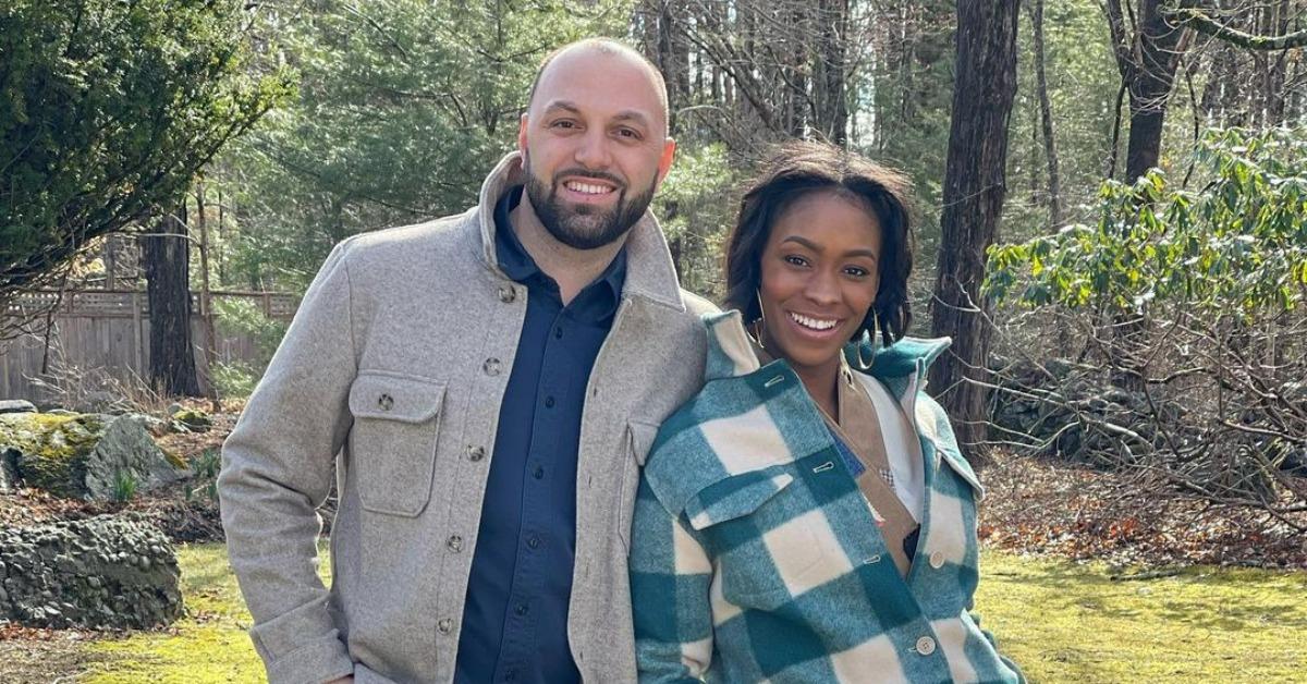 HGTV's Denese and Mike Butler pose together outside.