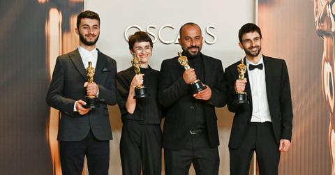 Hamdan Ballal and the directors of 'No Other Land' at the Oscars.