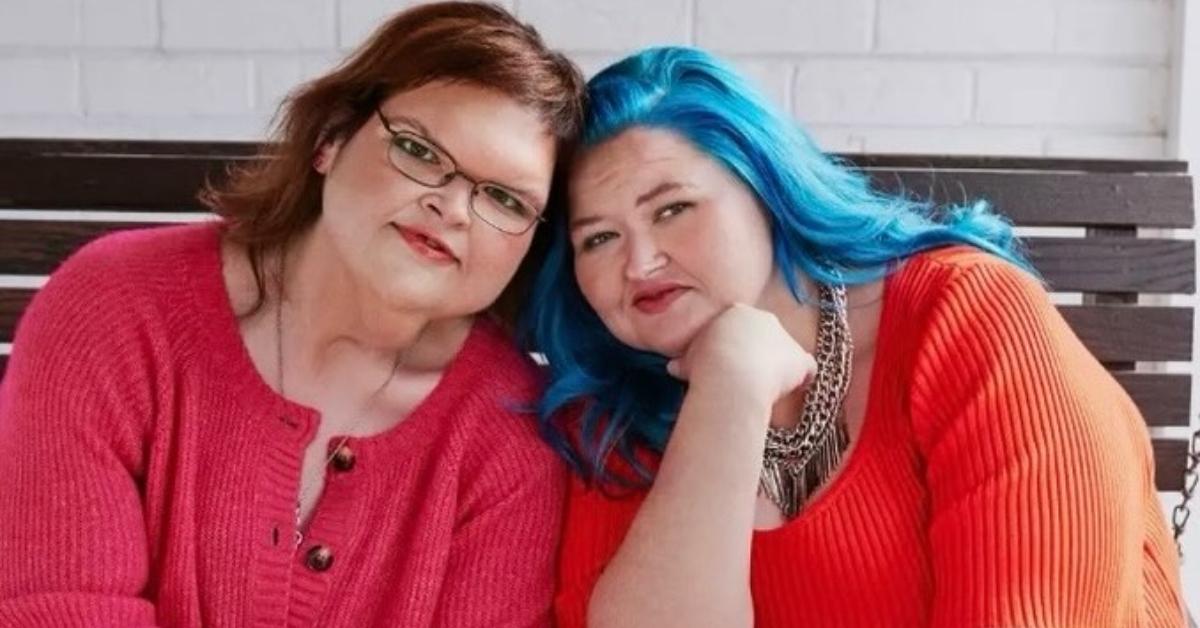 Tammy and Amy Slaton sit on a bench together outside