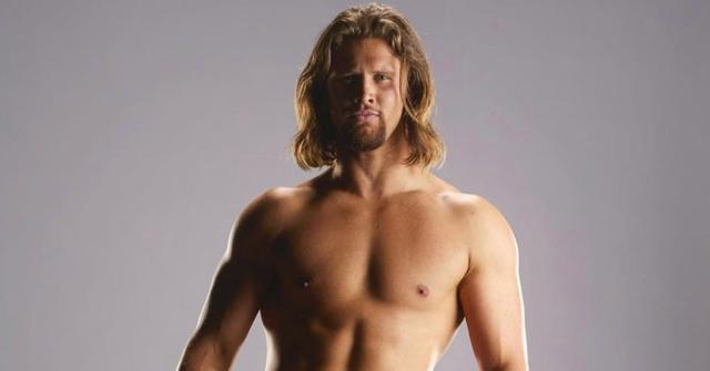 The Bachelorette Season 20 contestant Caleb B. poses in wrestling gear