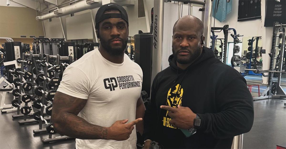 AJ Simon and James Harrison in a weight room together. 