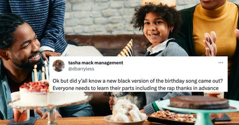 Black family sings happy birthday to son.