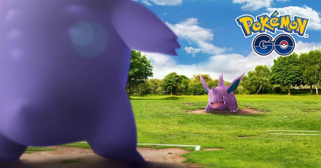 'Pokémon GO' Two creatures preparing to battle on a grassy arena.