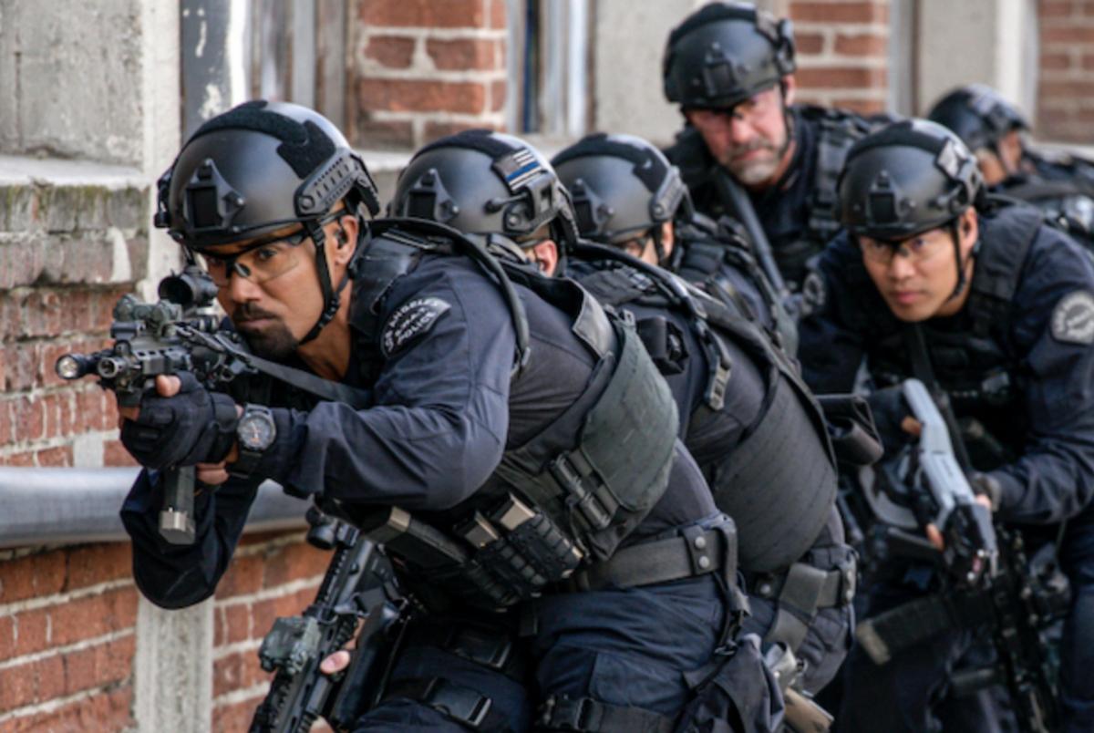 'S.W.A.T' officers entering a building to get the bad guys.