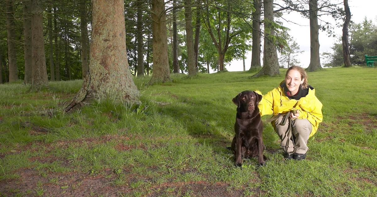 Small woman with big dog