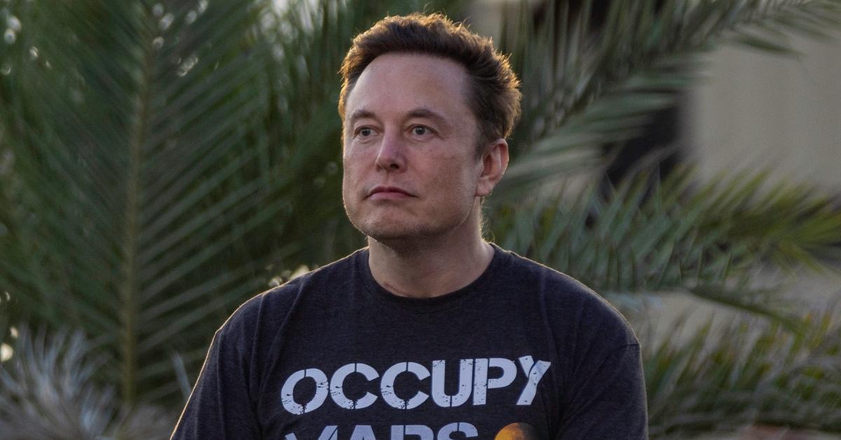 Tech entrepreneur Elon Musk wears an "Occupy Mars" shirt.