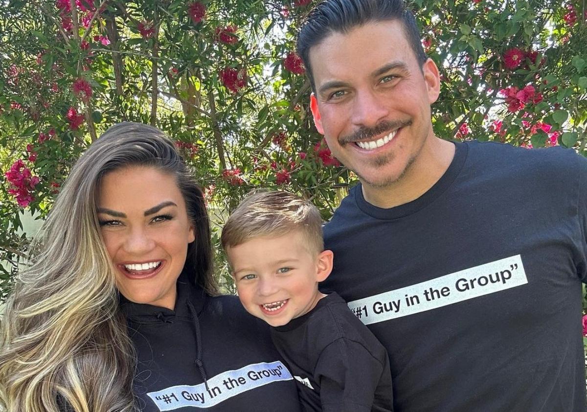 Brittany, Cruz, and Jax in their backyard wearing matching shirts