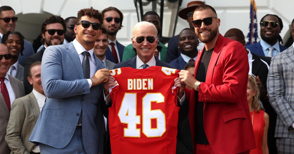 Patrick Mahomes and Travis Kelce present U.S. President Joe Biden with a Chiefs jersey at the White House on June 5, 2023.