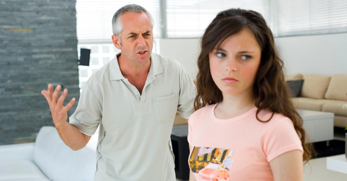 A dad having a disagreement with his daughter
