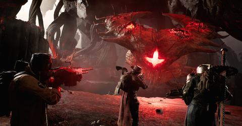 'Remnant II' Players with guns fighting a big alien boss.
