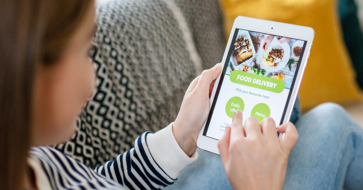 A woman orders food from her smart phone 