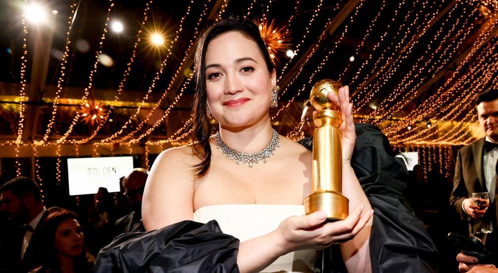 Lily Gladstone holding her Golden Globe award in 2024