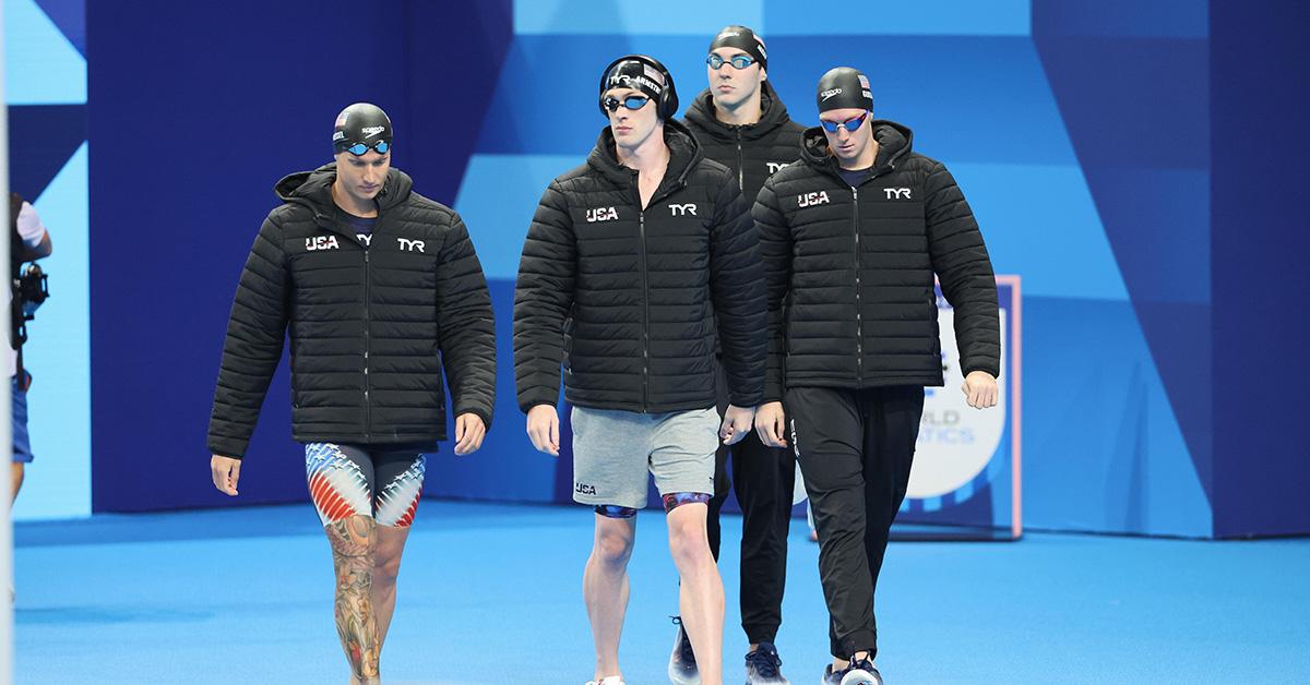 The 4x100m freestyle U.S. team wearing coats before their race. 