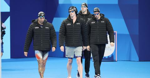 The 4x100m freestyle U.S. team wearing coats before their race.
