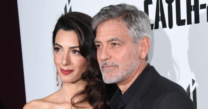 (l-r): Amal Clooney and George Clooney on the red carpet.