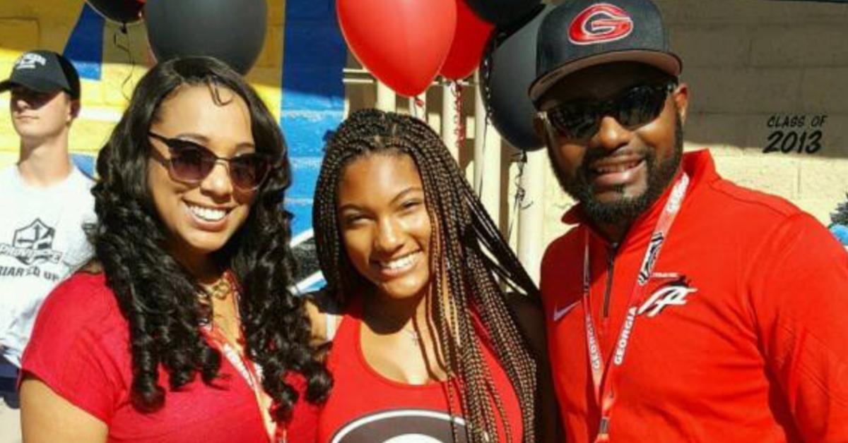 Tara Davis-Woodhall with her mom Rashon and dad Ty in red