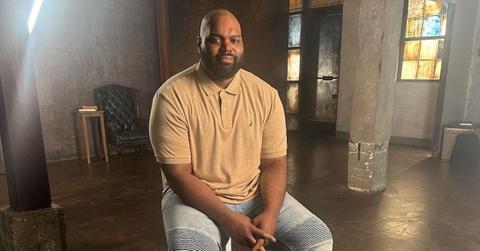 Retired NFL player Michael Oher wearing a tan polo shirt