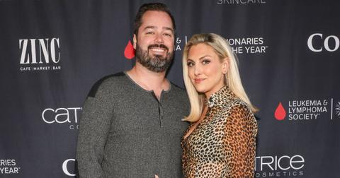 Travis Mullen and Gina Kirschenheiter pose for photo together at a red carpet event