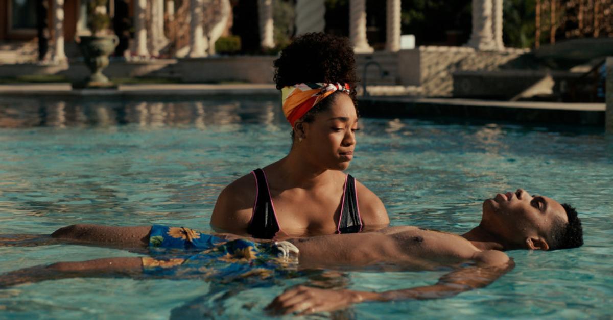 Lisa (Simone Joy Jones) teaches Will (Jabari Banks) how to float in the Banks family pool in Season 2 of 'Bel-Air.'