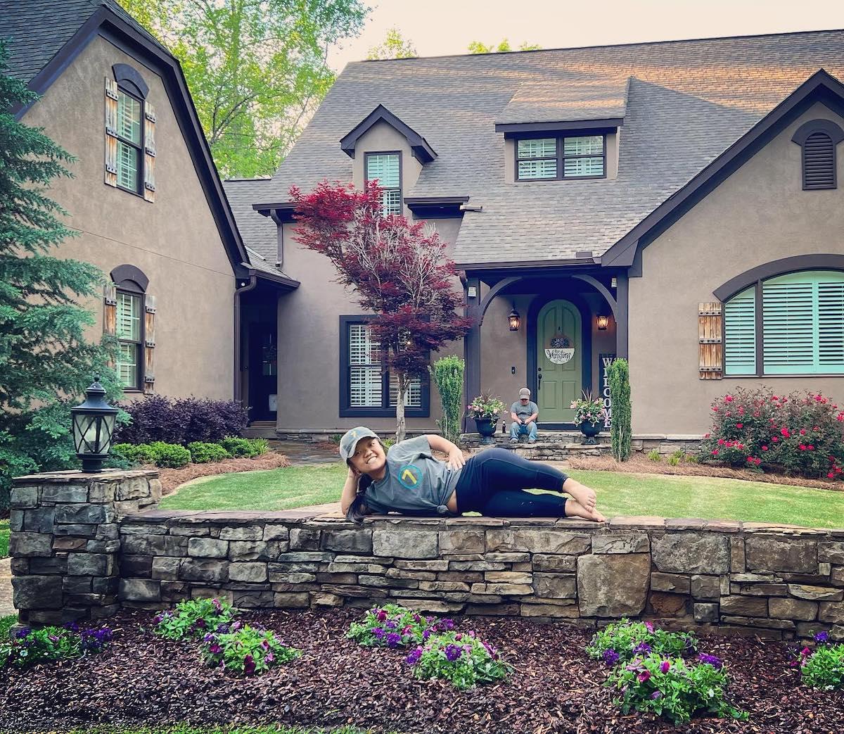 Emma from '7 Little Johnstons' posing in front of house