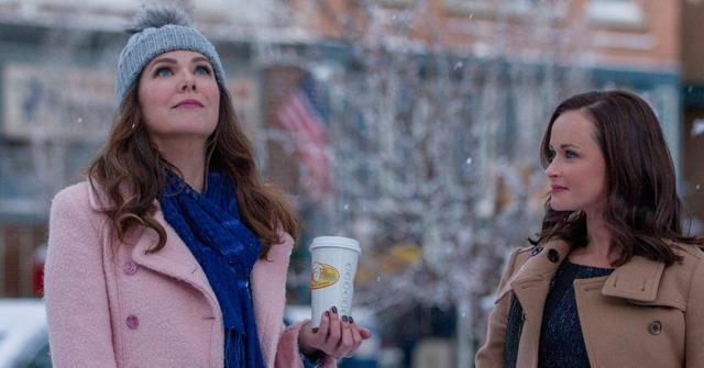 Lorelei and Rory Gilmore stand outside in a snowy Stars Hollow