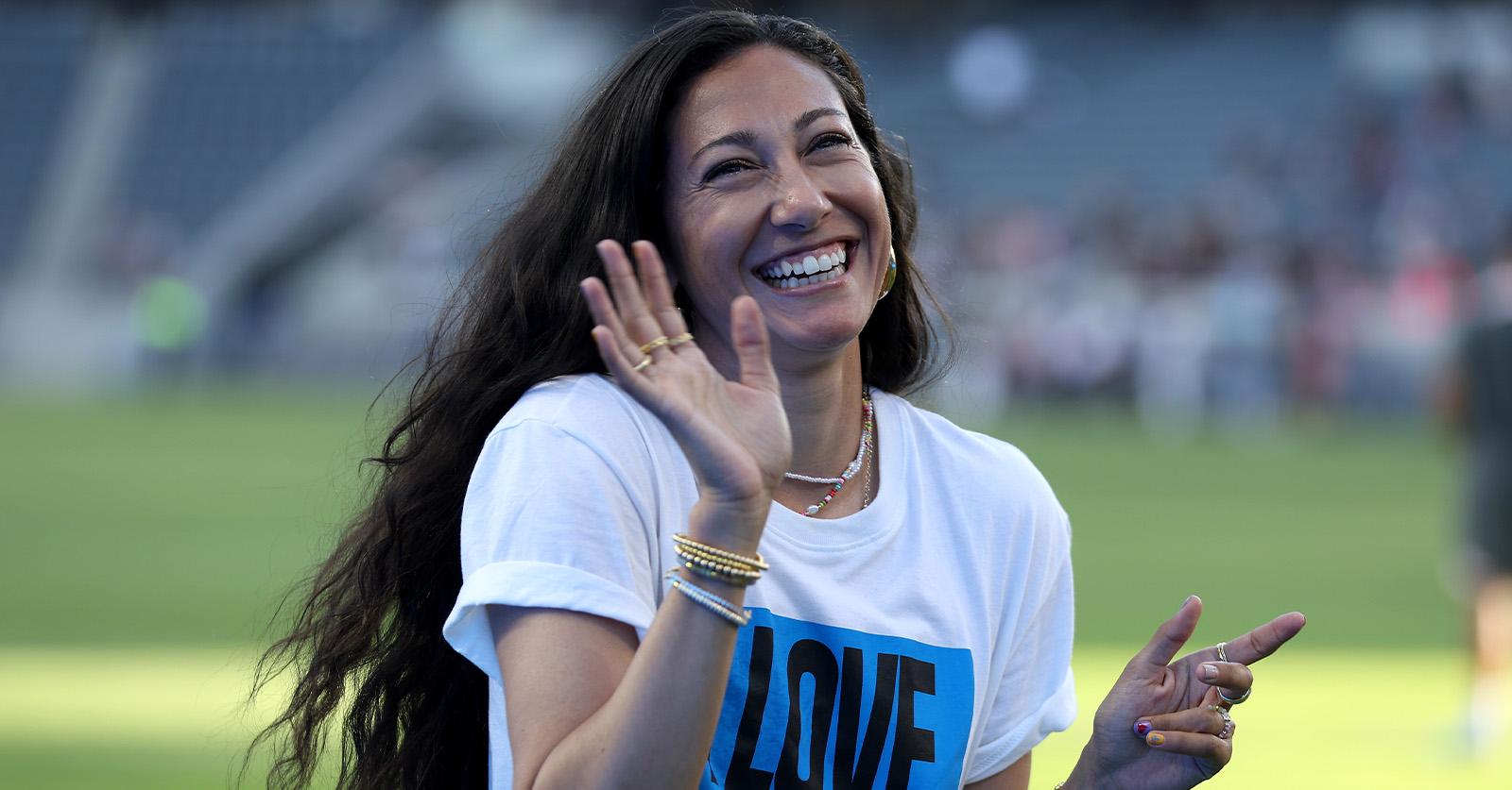 christen press waving