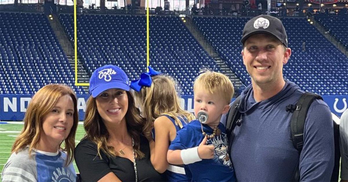 Nick and Tori Foles with their two children on the Colts football field. 