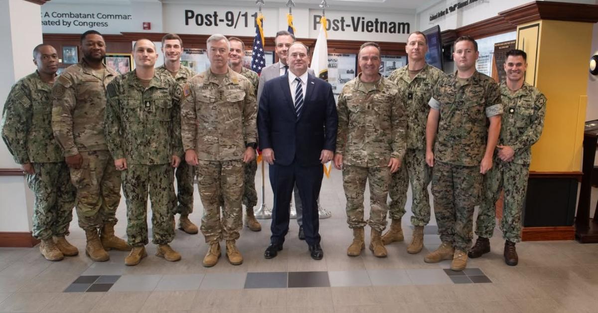 John Phelan posing with soldiers.