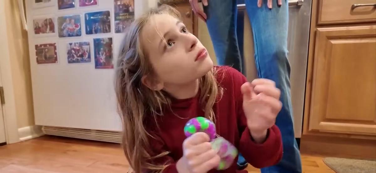 Becky Quick’s daughter Kaylie in their home with family.