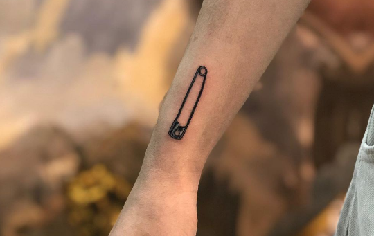 Safety pin tattoo