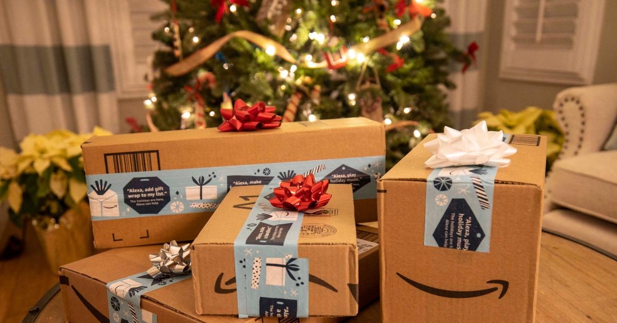 Amazon boxes in front of a Christmas tree
