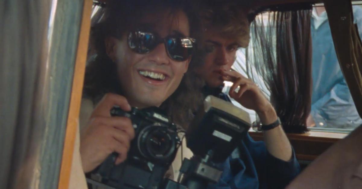 Wham! members and Andrew Ridgeley and George Michael smiling in a car