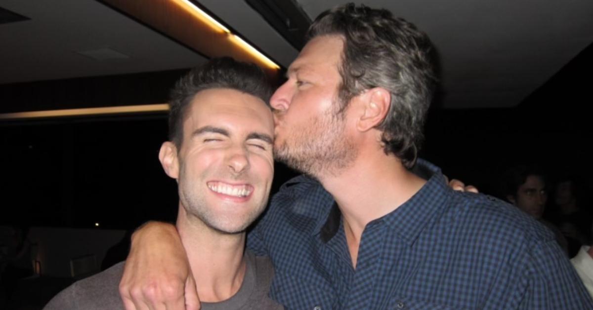 Blake Shelton kisses Adam Levine during at an after party during Season 1 of 'The Voice'