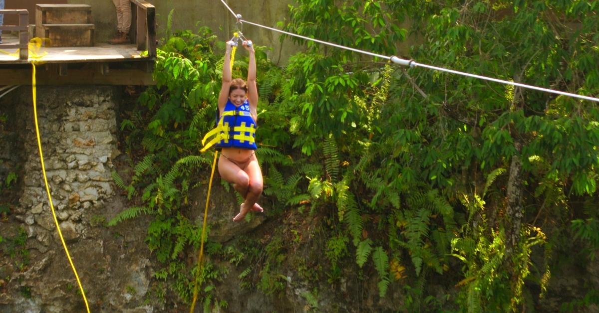 Julie Theis ziplining during Season 1 of 'The Trust: A Game of Greed'