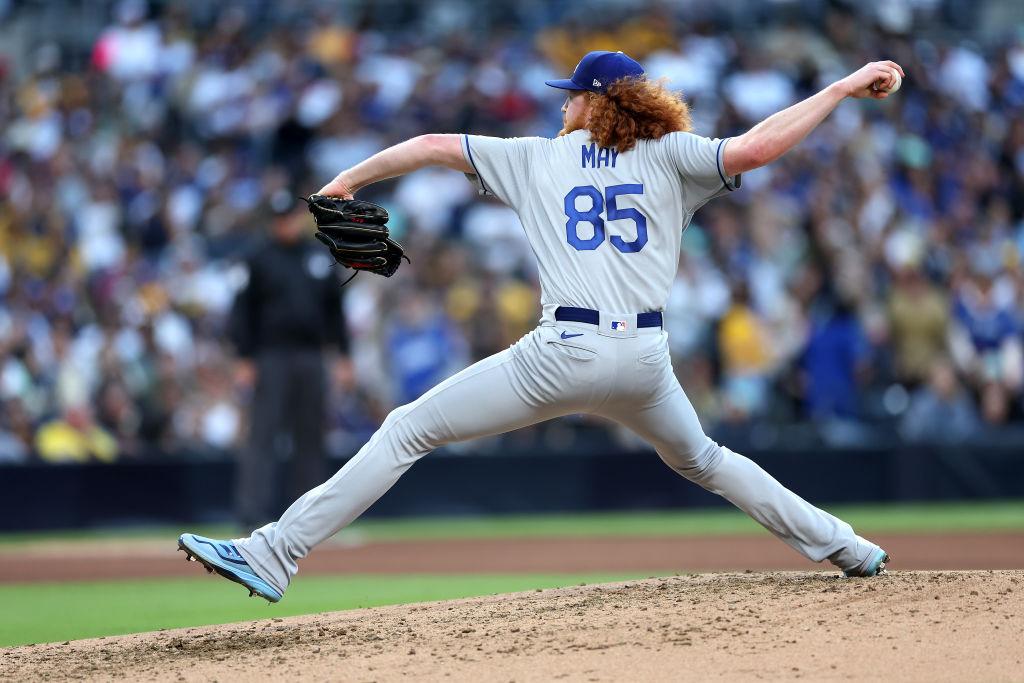 Dodgers pitcher Dustin May leaves after taking line drive off the face