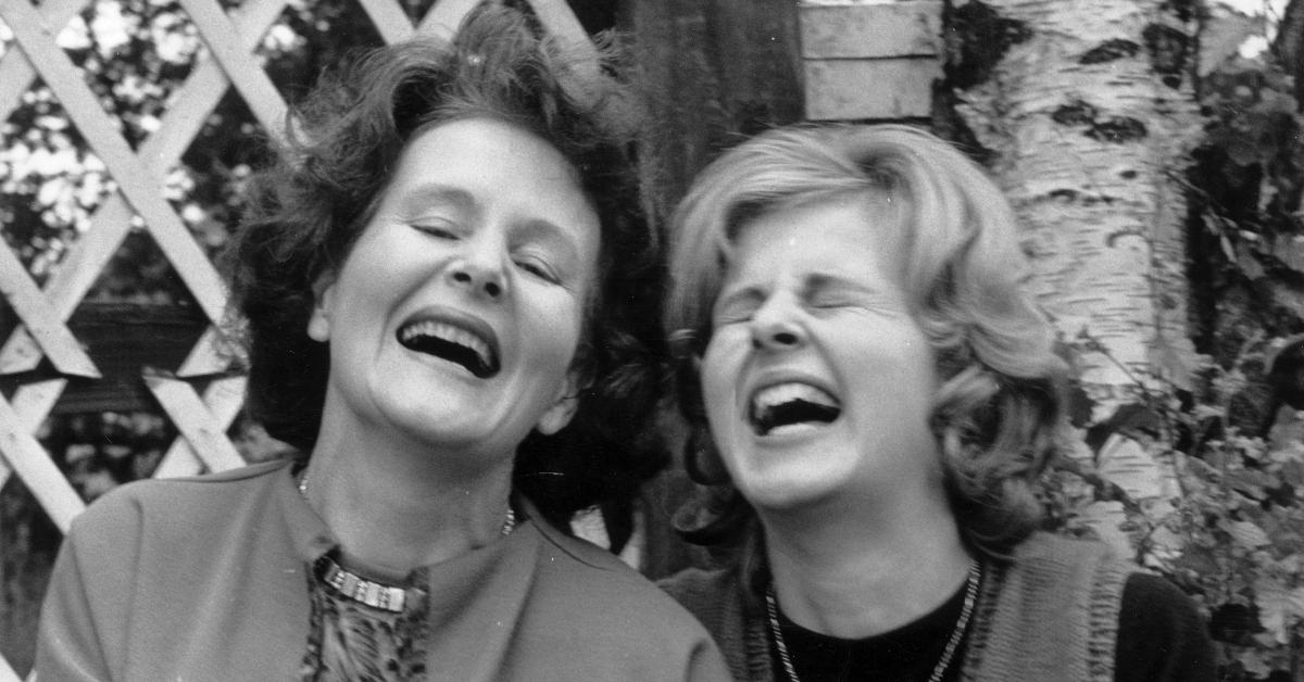 Two women laughing, circa 1950.