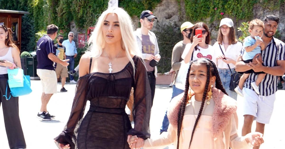 (l-r): Kim Kardashian and North West walking outside