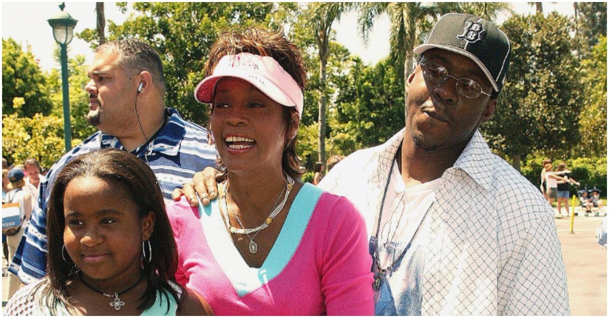 Bobbi Kristina Brown, Whitney Houston, and Bobby Brown smiling at the premiere of 'The Princess Diaries 2' 